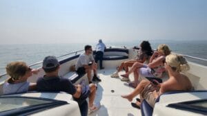 Group of cruise passengers enjoying a private speedboat ride to Elephanta Caves from Mumbai Harbour