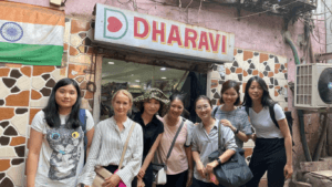 Travel group visiting Dharavi neighborhood during a guided Mumbai cultural tour