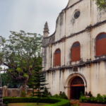 Historic colonial church in Kerala with arched entrance