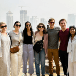 Happy tour group at Mumbai city viewpoint during a guided Highlights of Mumbai sightseeing tour