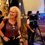 Tourist visiting Bollywood film set in Mumbai studio during guided city tour