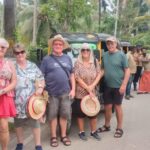 Tourists interacting with locals during a guided village walk in Kumbalangi near Kochi
