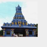 Traditional Hindu temple in Mangalore featuring ornate blue and gold gopuram architecture