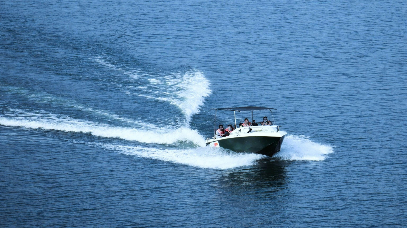 Premium speedboat traveling from Mumbai to Elephanta Caves across Mumbai Harbour, offering the fastest way to reach Elephanta Island in about 20 minutes.